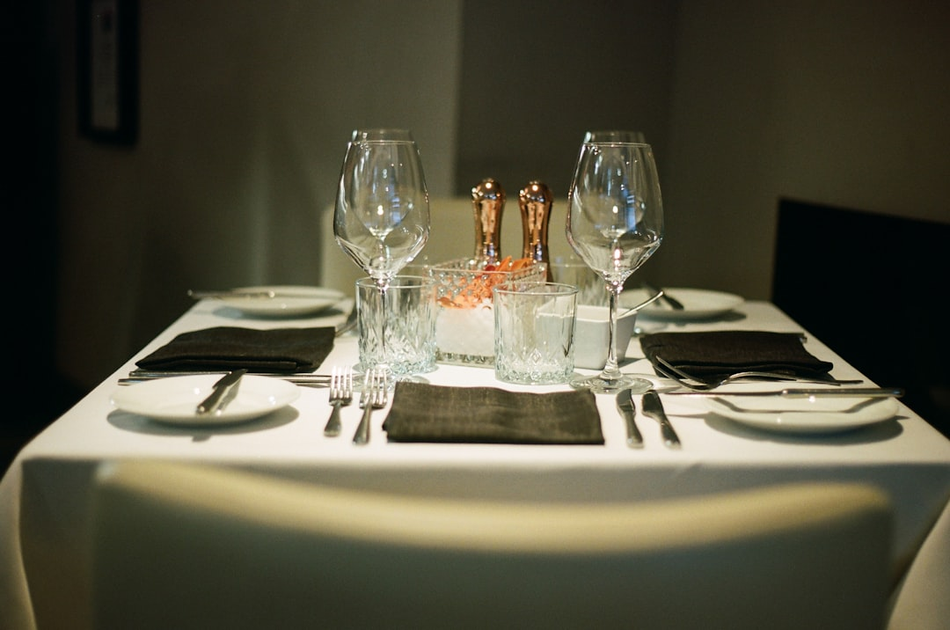 Gourmet fine dining experience at a five-star all-inclusive resort with artistically plated cuisine and sommelier wine service